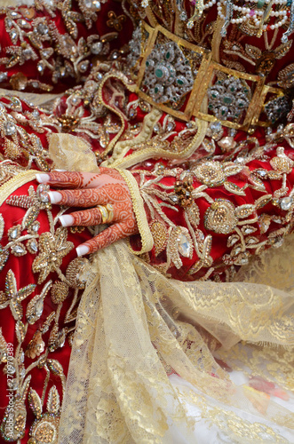 Henna being applied on bride's hand
