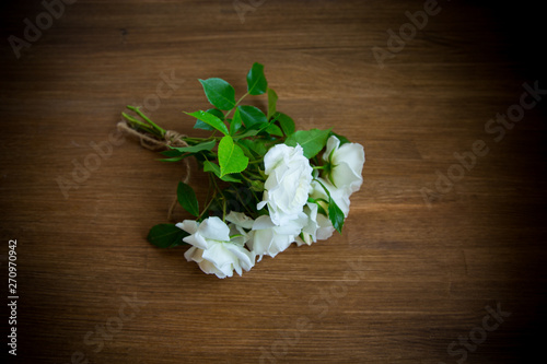 bouquet of beautiful white roses on table