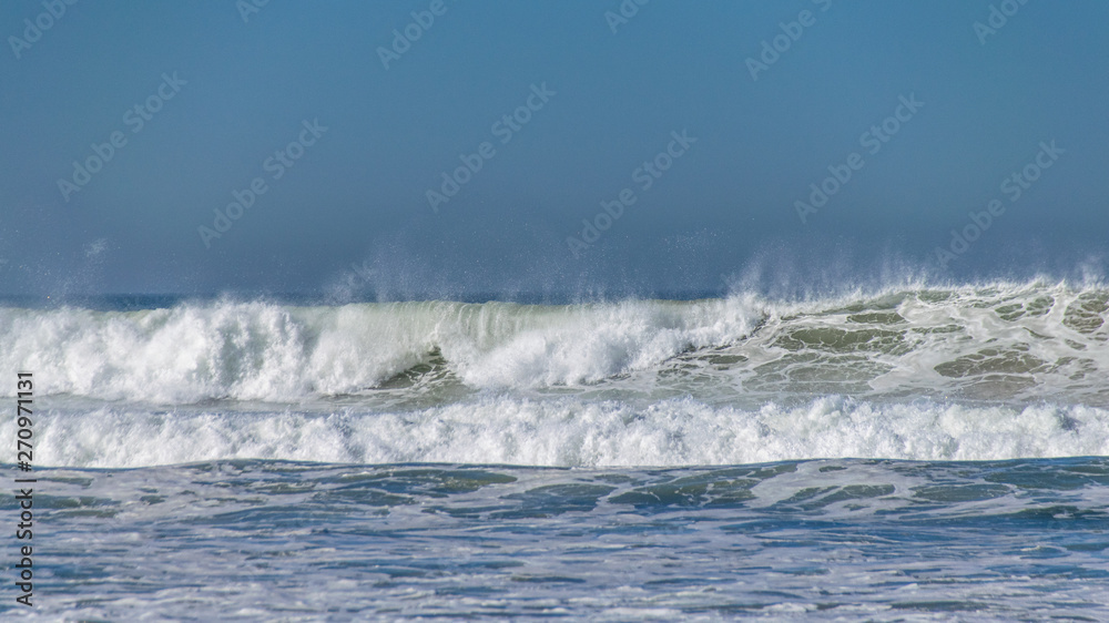 Atlantic ocean waves breaking onto beach in Agadir, Morocco