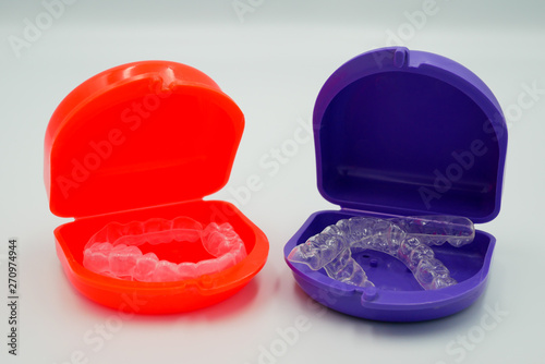 Clear plastic retainer teeth in the boxset, it's a new technology equipment for orthodontist give the patient to orthodontic surgery in dental clinic or hospital
