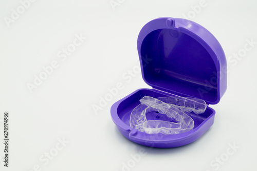 Clear plastic retainer teeth in the boxset, it's a new technology equipment for orthodontist give the patient to orthodontic surgery in dental clinic or hospital