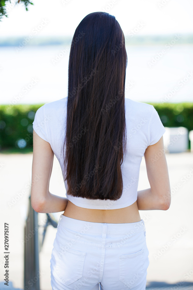 Female brunette hair, rear view, summer park
