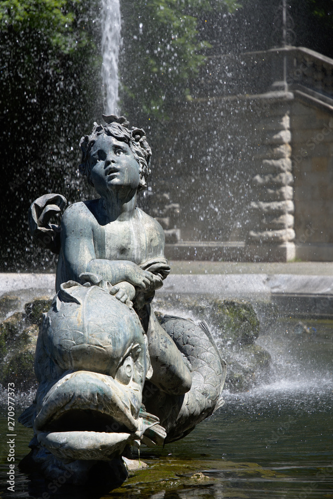 Statue at water fountain at the Angel of Peace (Friedensengel9 monument in Munich, Germany Statue at water fountain at the Angel of Peace (Friedensengel9 monument in Munich, Germany