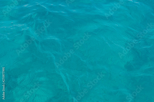 blue water background smooth surface with small waves