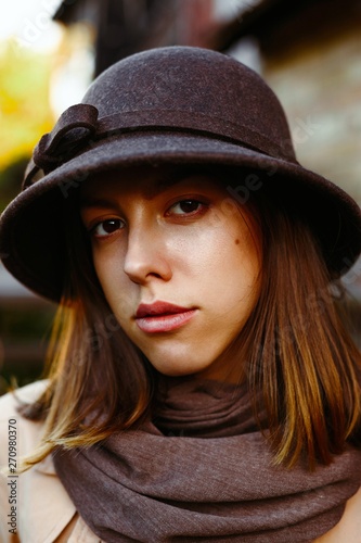 portrait of attractive young woman in old fashioned hat © smmartynenko