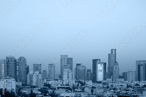 Cityscape, modern building on a blue background. Toning