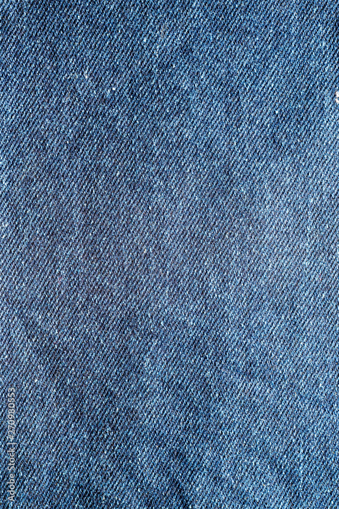 Close up of blue denim jeans fabric texture background. Close up of blue denim jeans fabric texture background.