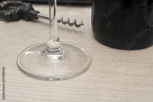 Bild auf Leinwand vintage wine opener, glass and wine bottle on a wooden background