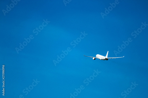  Flight to vacation airplane in the bright blue sky after takeoff