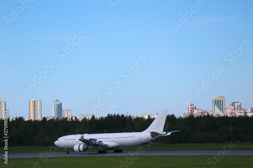 Bild auf Leinwand widebody white airplane with two engines on the runway after landing in the pulk