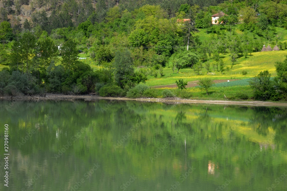 reflection of coastline in the lake reflection of coastline in the lake