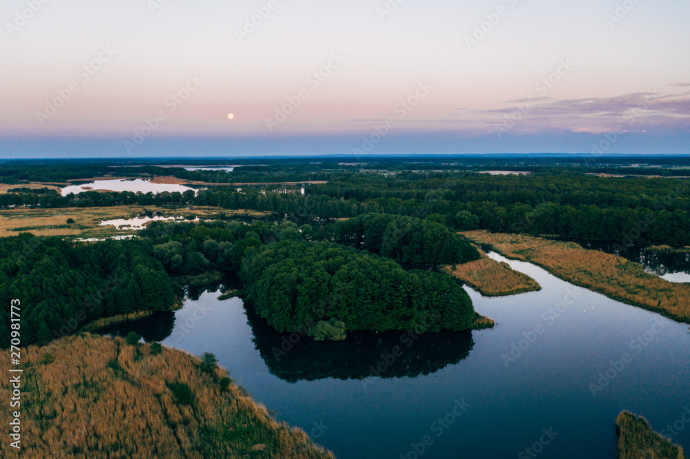 Aerial shot of the fishing ponds after sunset, southern Poland. Milicz, Barycz Valley Landscape Park.