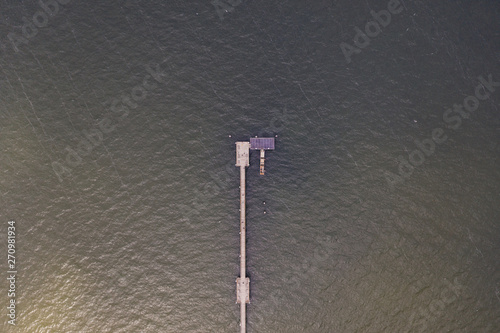 Aerial topdown view of the end of the pier on the sea.  photo