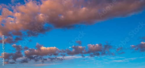 Warm and Colorful Clouds with moon rising