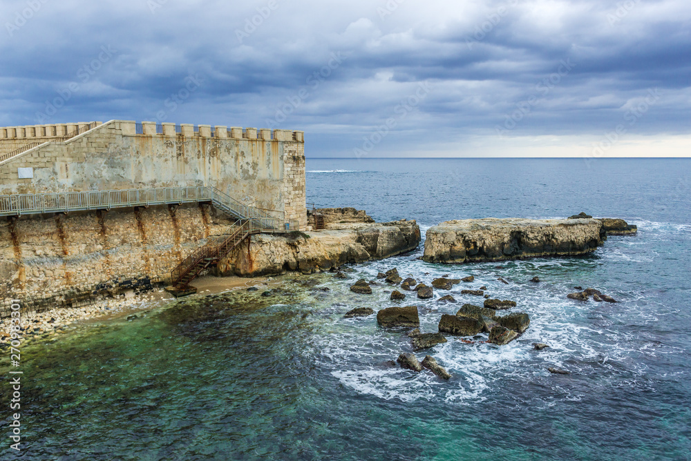 Walls of Ortygia isle on Ionian Sea, Syracuse city, Sicily Island in Italy