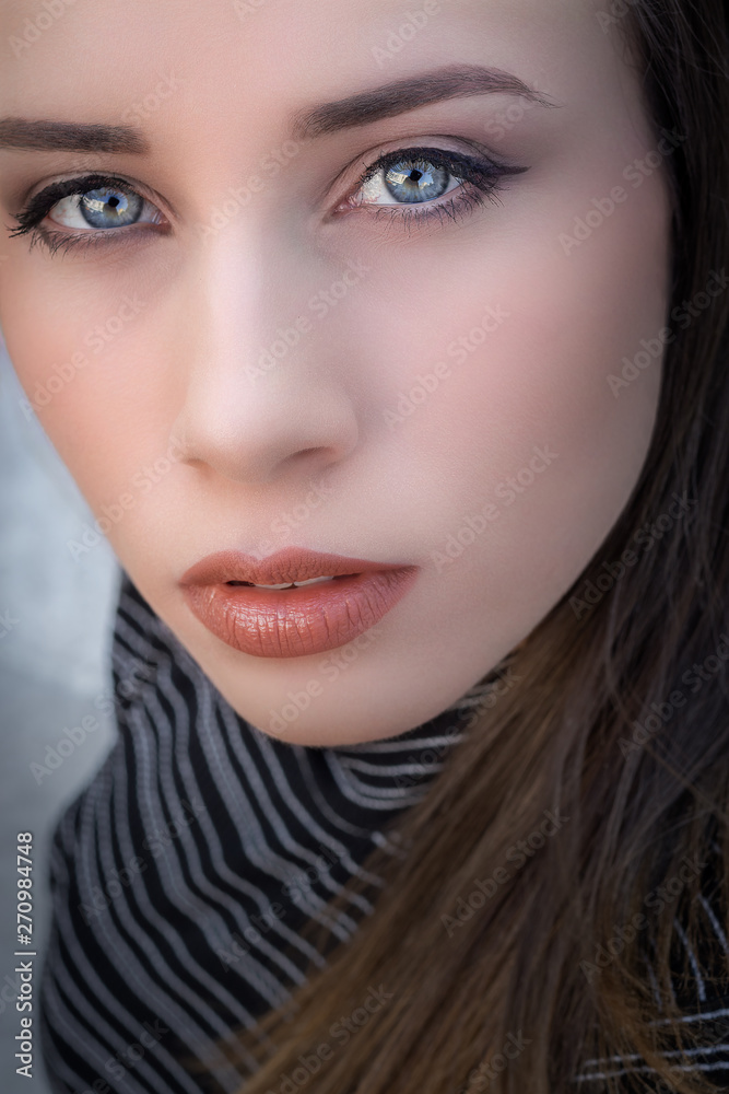 Intense close-up of a beautiful blue-eyed woman Intense close-up of a beautiful blue-eyed woman