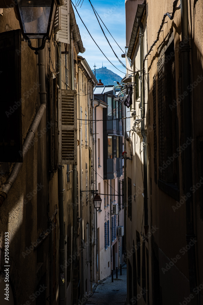 view on narrow alleyway between houses