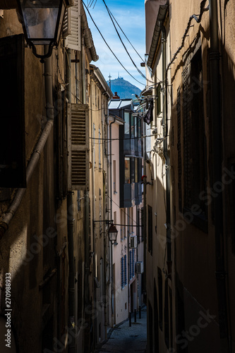 view on narrow alleyway between houses