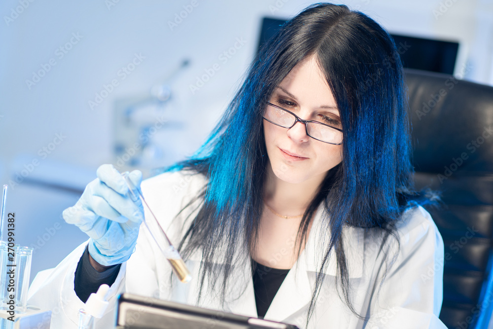 DNA analysis. Woman conducts cytogenetic analysis of biomaterial. DNA diagnosis. Laboratory of molecular genetics. Karyotyping. Gene engineering. DNA analysis. Woman conducts cytogenetic analysis of biomaterial. DNA diagnosis. Laboratory of molecular genetics. Karyotyping. Gene engineering.