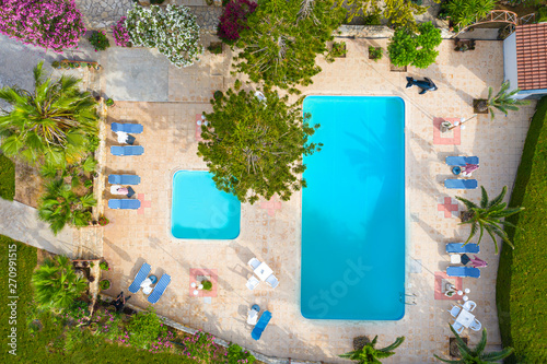 Cyprus. View of the pools with sun loungers on top. Relax by the pool. Sunbathing by the pool. Spa resort. Recreation. Vacation in Cyprus. Pool with drone.