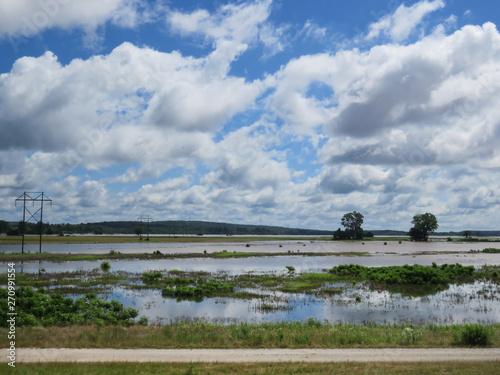 Flood waters cover fields along the Arkansas River in eastern Oklahoma