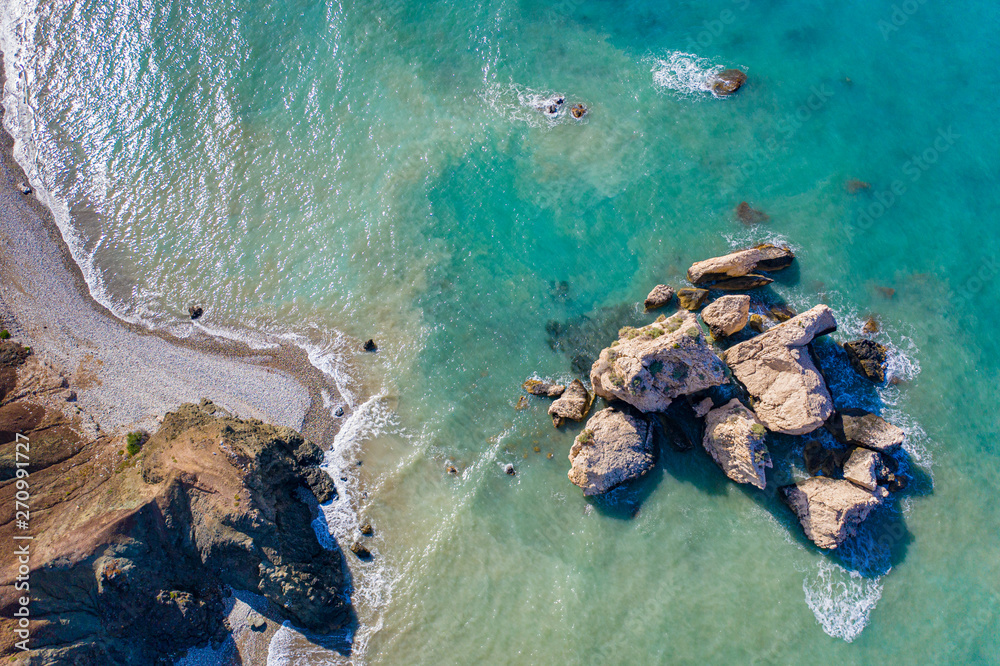 Cyprus. Cyprus Aphrodite's rocks, the view from the top. Aphrodite Bay. Petra-Tu-Romiou. Mediterranean sea. The rocks in the sea. Paphos.  The Cyprus beaches. Coast with drone. Waves on the shore.