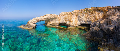 Cyprus. Ayia Napa. Love bridge. Rock arch in the sea.  The Cape Greco . The Mediterranean sea picturesque coast. Natural attractions of Cyprus. Panorama of the Republic of Cyprus. Turquoise water.