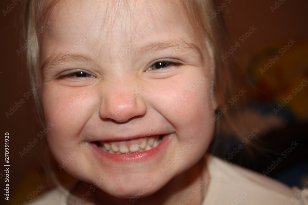 little girl laughs and makes faces, portrait little girl laughs and makes faces, portrait