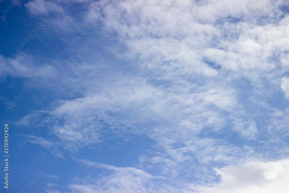 Blue Sky And White Clouds. Horizontal Shot Of A Beautiful Sky Background. Heaven, Nature, Landscapes Concept. Blue Sky And White Clouds. Horizontal Shot Of A Beautiful Sky Background. Heaven, Nature, Landscapes Concept.