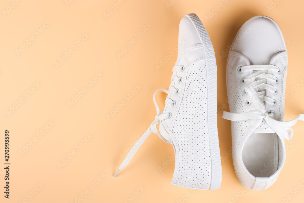 white sneakers on color background. copy space. white sneakers on color background. copy space.