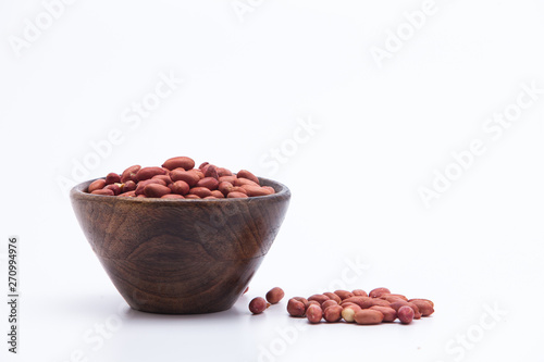  Redskin peanuts in wooden bowl isolated