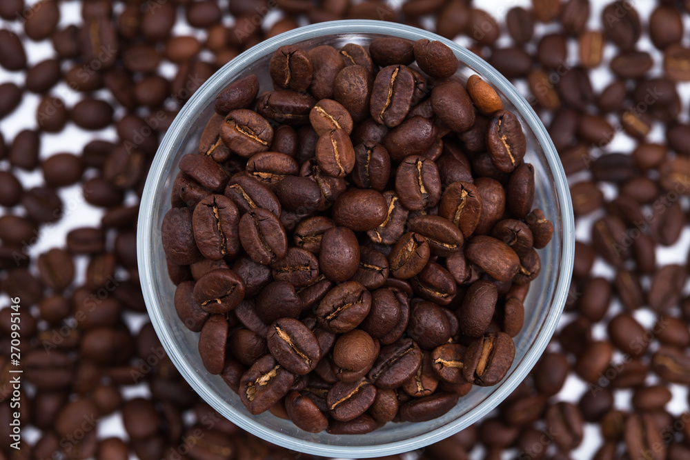 Fototapeta premium Coffee beans with a glass