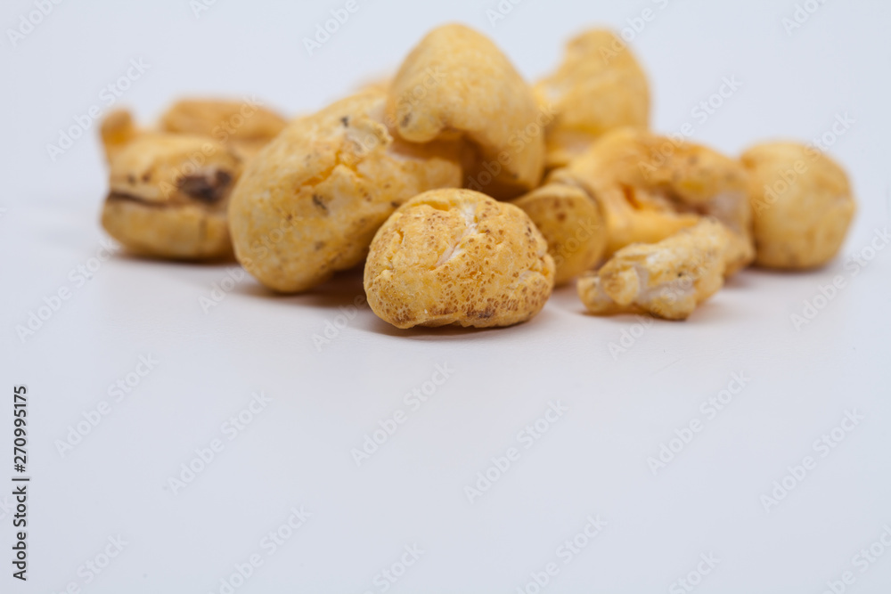 Roasted soft corn snack isolated on white Roasted soft corn snack isolated on white