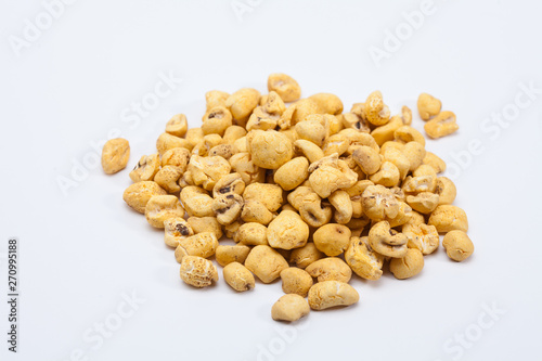 Roasted soft corn snack isolated on white
