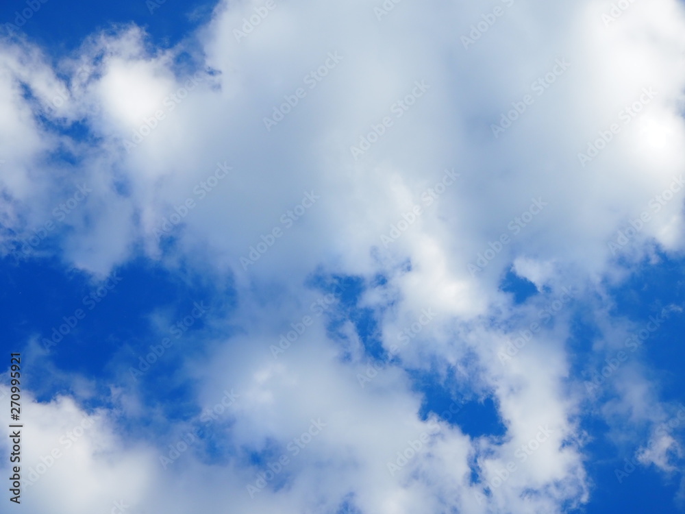 Blue sky with white clouds in summer. Sunlight, abstract, background Blue sky with white clouds in summer. Sunlight, abstract, background