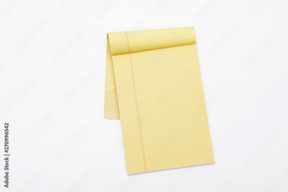 Yellow pencil on lined note paper isolated Yellow pencil on lined note paper isolated
