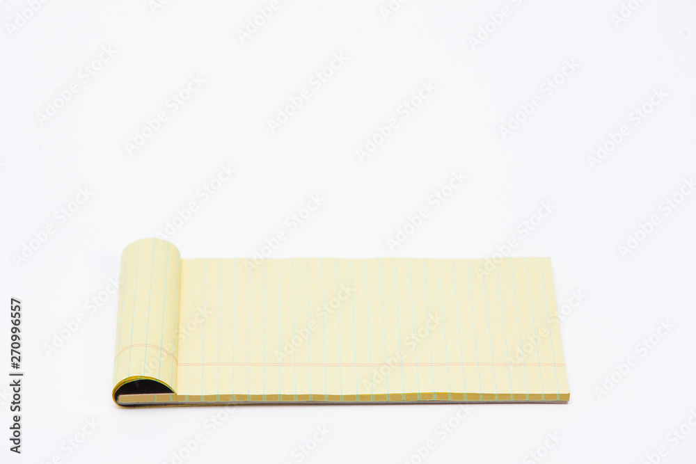 Yellow pencil on lined note paper isolated Yellow pencil on lined note paper isolated