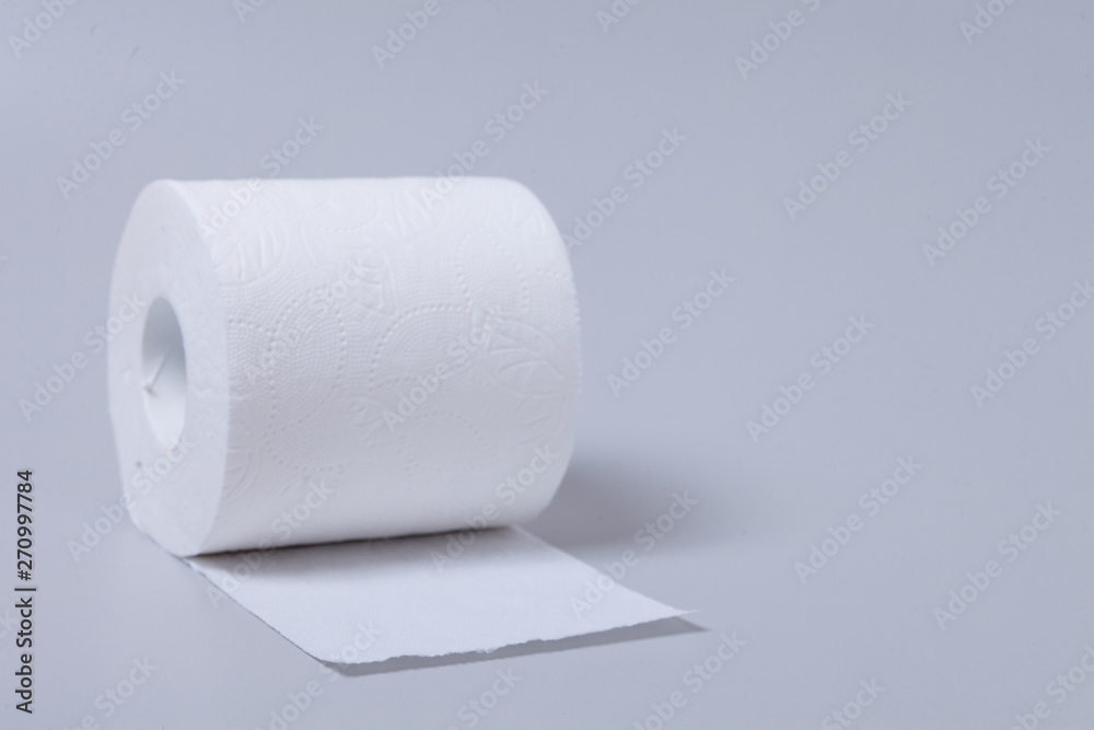 Obraz premium Toilet paper roll isolated on gray background