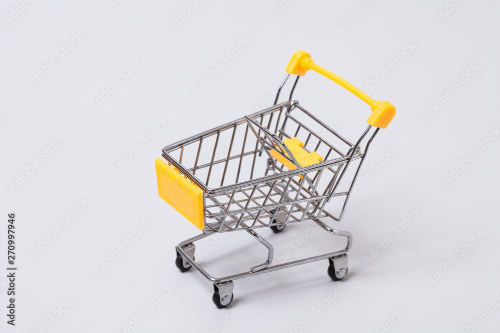  Empty brown shopping cart on gray 