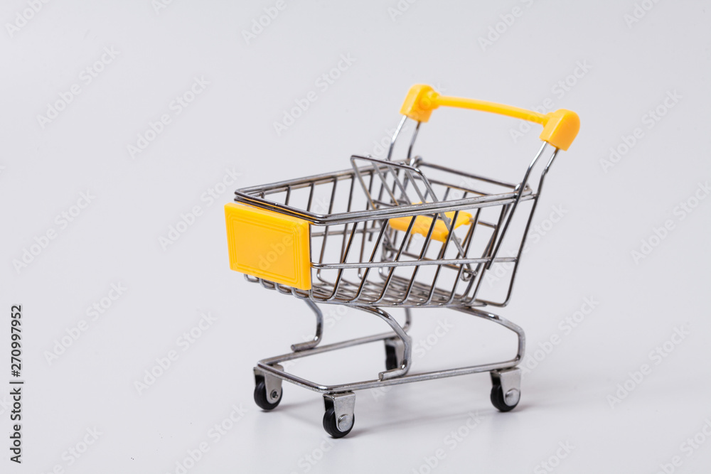  Empty brown shopping cart on gray 