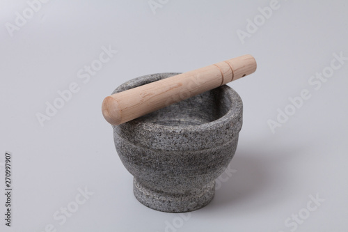 Stone mortar pestle on gray