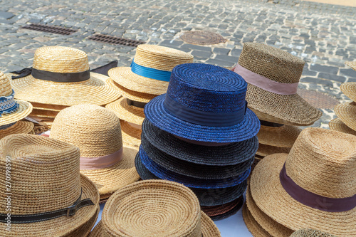 Straw hats for sale, for men and women of light colors.