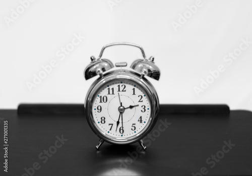 Alarm clock on table with silver color