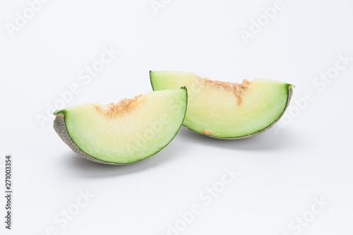 Sliced green cantaloupe melon isolated on white background