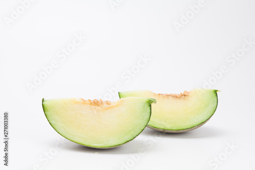 Sliced green cantaloupe melon isolated on white background