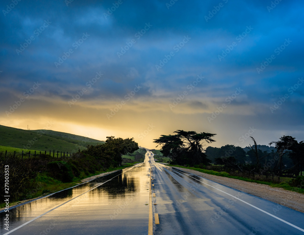 Fototapeta premium Rainy Road Glows with Morning Light