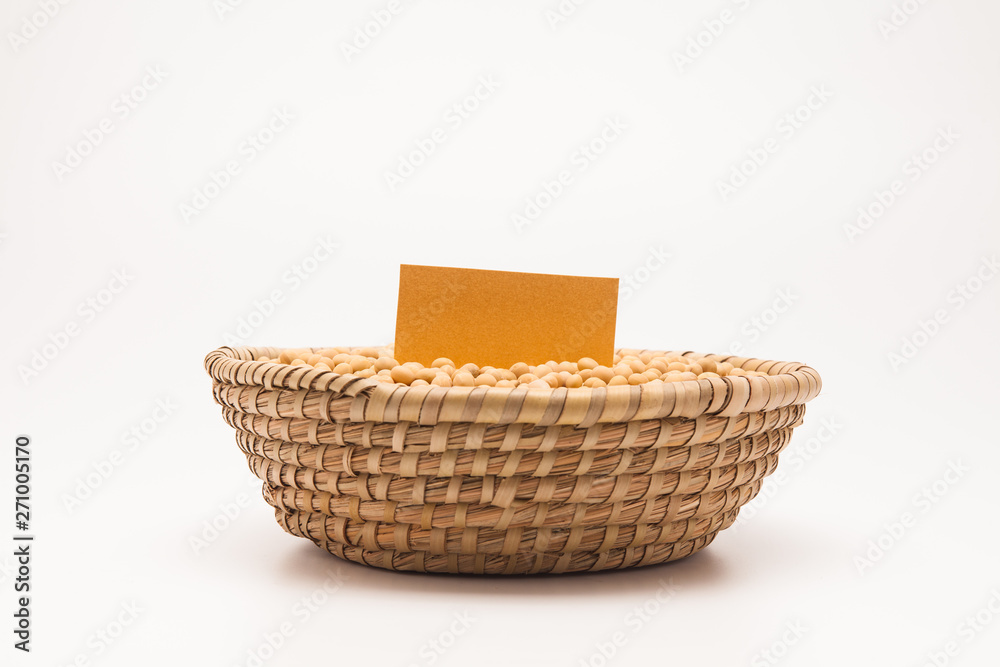 Blank paper with Soybeans in basket isolated on white background