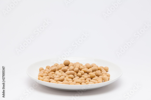 Round dish with soybeans isolated