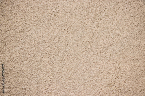 Beige stucco wall texture wide shot