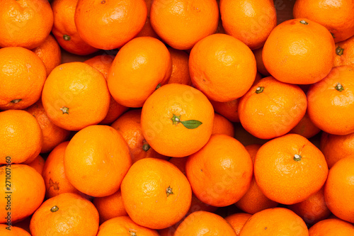 A pile of organic fresh juicy mandarin oranges